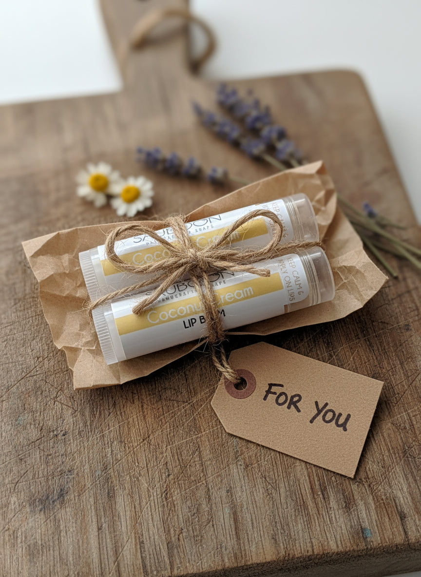 Our handcrafted luxurious lip balms are made locally here in San Diego in small batches.  Highest quality ingredients used to give the best moisture, nourishment, and pampered experience.  All our lip balms are made with coconut oil, cocoa butter, shea butter and lip safe flavor oils that smell amazing! Great for gifting for birthdays, party favors, celebrations, bridal showers or self care gift to yourself!