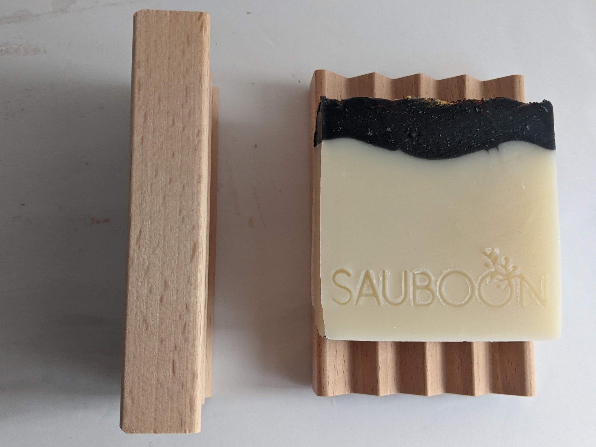 Handcrafted soap dish made in the USA.  Hardy beechwood, allows for a long life while using handcrafted soaps.  The grooves allow for water to drain away, keeping the soap dry in between use.  Makes a fantastic gift along with our luxurious handcrafted soaps, made in small batches here in San Diego.